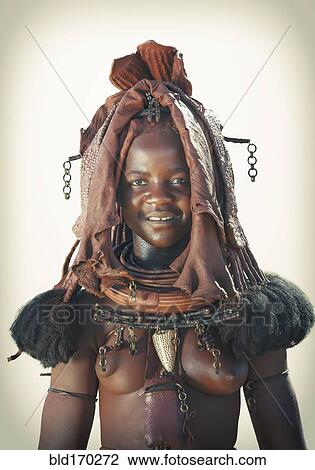 Stock Image - Black woman wearing traditional headdress. Fotosearch