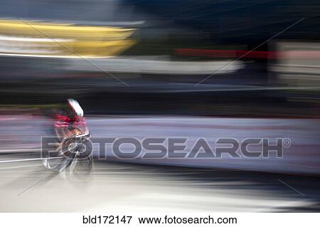 Stock Photo - Blurred view of cyclist competing in race. Fotosearch
