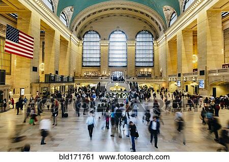 Stock Image - Blurred view of people in train station, New York, New York, United States. Fotosearch