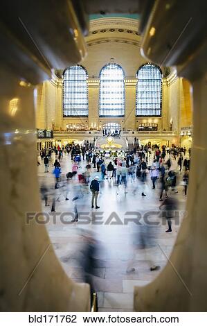 Stock Image - Blurred view of people in train station, New York, New York, United States. Fotosearch