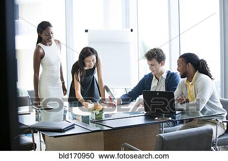 Business people talking in office meeting View Large Photo Image Stock Image - Business people talking in office meeting. Fotosearch