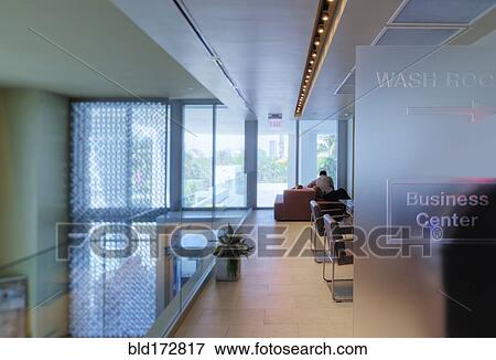 Stock Photo - Businessman working in office lounge. Fotosearch
