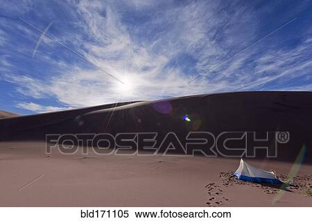 Stock Photography - Camping tent in desert sand dunes. Fotosearch