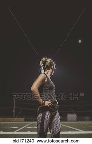 Caucasian athlete resting on sports field View Large Photo Image Stock Image - Caucasian athlete resting on sports field. Fotosearch