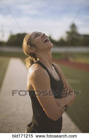 Caucasian athlete standing on sports field View Large Photo Image Stock Photography - Caucasian athlete standing on sports field. Fotosearch
