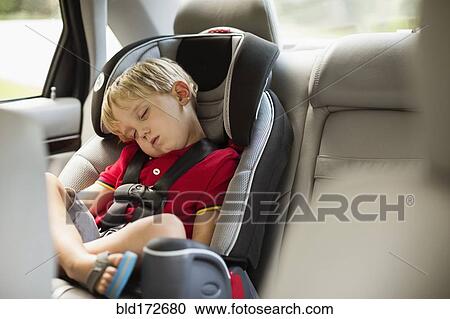 Caucasian boy napping in car seat View Large Photo Image Stock Image - Caucasian boy napping in car seat. Fotosearch