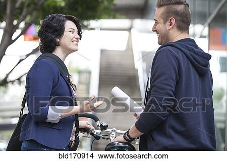 Caucasian business people talking outside office View Large Photo Image Picture - Caucasian business people talking outside office. Fotosearch