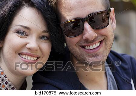 Caucasian couple smiling outdoors View Large Photo Image Stock Photography - Caucasian couple smiling outdoors. Fotosearch
