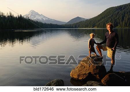 Stock Photograph - Caucasian father and son standing by Lost Lake, Hood River, Oregon, United States. Fotosearch