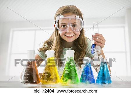 Caucasian girl doing science experiment View Large Photo Image Picture - Caucasian girl doing science experiment . Fotosearch