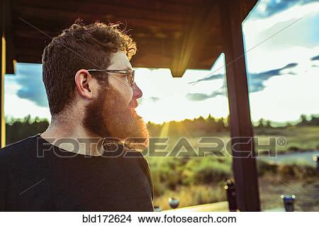 Caucasian man admiring view of remote landscape View Large Photo Image Picture - Caucasian man admiring view of remote landscape. Fotosearch
