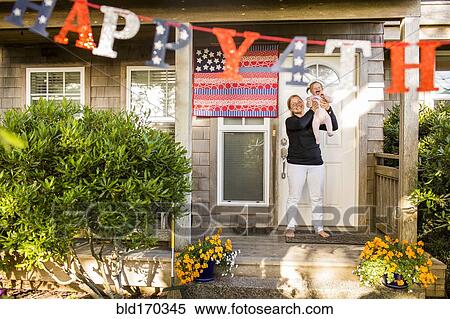 Caucasian mother and baby daughter celebrating 4th of July View Large Photo Image Stock Photography - Caucasian mother and baby daughter celebrating 4th of July. Fotosearch