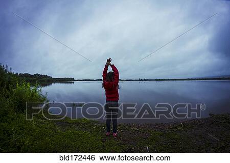 Caucasian teenage girl stretching by remote lake View Large Photo Image Stock Photograph - Caucasian teenage girl stretching by remote lake. Fotosearch