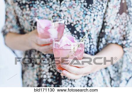 Caucasian woman carrying cocktails View Large Photo Image Stock Image - Caucasian woman carrying cocktails. Fotosearch