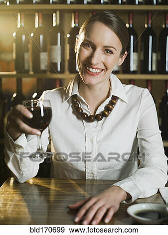 Caucasian woman drinking wine in restaurant View Large Photo Image Stock Photo - Caucasian woman drinking wine in restaurant. Fotosearch