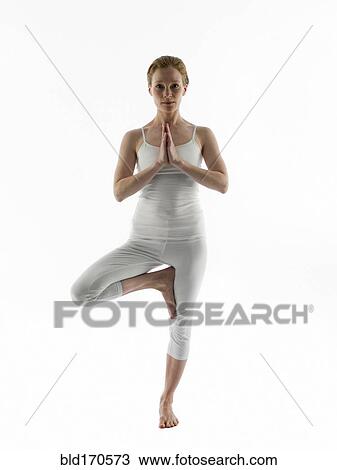Stock Image - Caucasian woman practicing yoga. Fotosearch