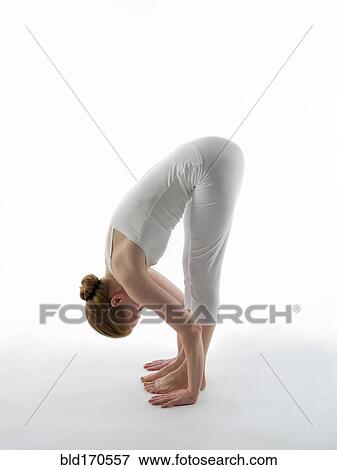 Stock Photo - Caucasian woman practicing yoga. Fotosearch