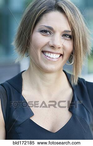 Caucasian woman smiling outdoors View Large Photo Image Stock Photography - Caucasian woman smiling outdoors. Fotosearch