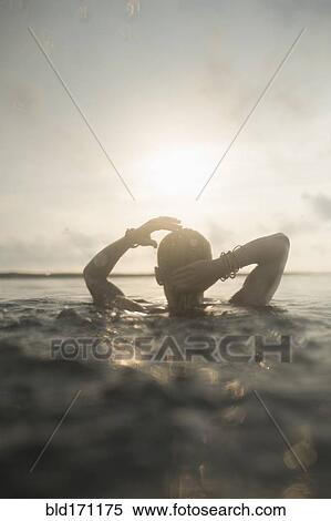 Caucasian woman swimming in still lake View Large Photo Image Stock Photography - Caucasian woman swimming in still lake. Fotosearch