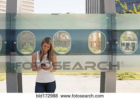Caucasian woman using cell phone View Large Photo Image Stock Photo - Caucasian woman using cell phone. Fotosearch