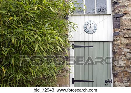 Clock on converted barn door View Large Photo Image Stock Image - Clock on converted barn door. Fotosearch