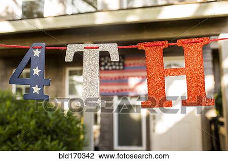 Stock Image - Close up of 4th of July banner decoration. Fotosearch