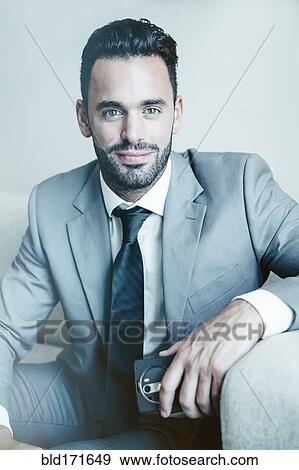 Stock Photo - Close up of businessman smiling. Fotosearch