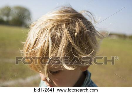 Close up of Caucasian boy in park View Large Photo Image Stock Image - Close up of Caucasian boy in park. Fotosearch