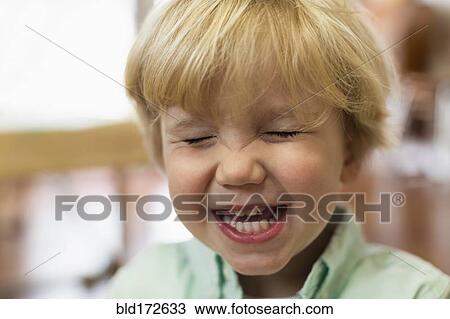 Close up of Caucasian boy laughing View Large Photo Image Stock Image - Close up of Caucasian boy laughing. Fotosearch
