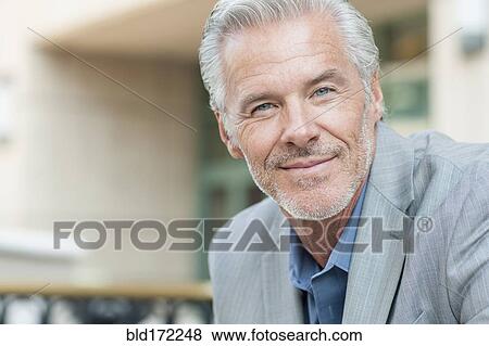 Stock Photo - Close up of Caucasian businessman smiling. Fotosearch