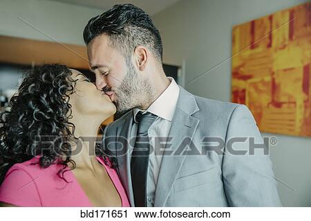 Stock Image - Close up of couple kissing. Fotosearch