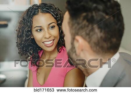 Stock Image - Close up of couple talking. Fotosearch