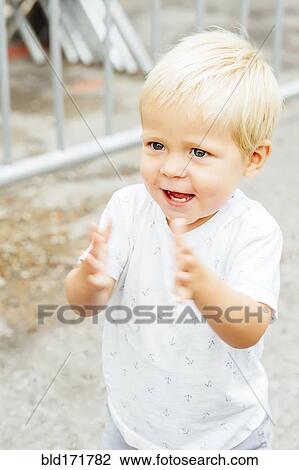 Close up of mixed race boy clapping outdoors View Large Photo Image Stock Image - Close up of mixed race boy clapping outdoors. Fotosearch
