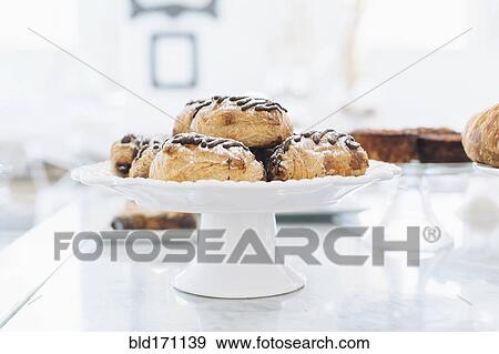 Close up of platter of donuts on cafe counter View Large Photo Image Stock Photo - Close up of platter of donuts on cafe counter. Fotosearch