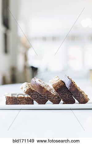 Close up of sliced coffee cake on cafe counter View Large Photo Image Stock Photo - Close up of sliced coffee cake on cafe counter. Fotosearch