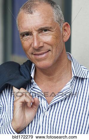 Close up of smiling Caucasian businessman View Large Photo Image Stock Photo - Close up of smiling Caucasian businessman. Fotosearch