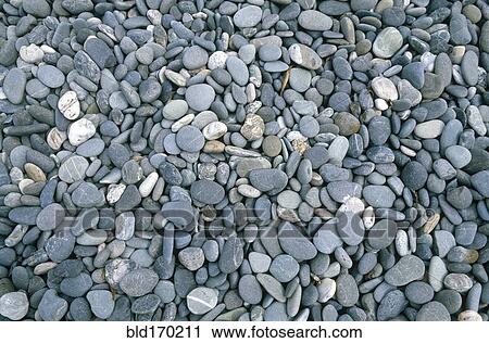Stock Image - Close up of smooth pebbles. Fotosearch