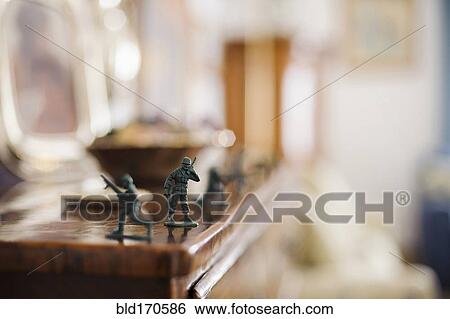 Stock Photograph - Close up of toy soldiers on mantelpiece. Fotosearch