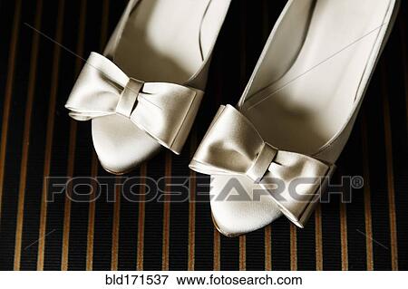 Close up of white high heels with bows View Large Photo Image Stock Photo - Close up of white high heels with bows. Fotosearch