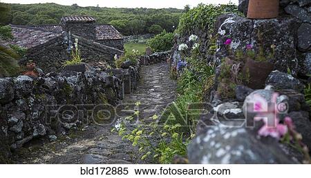 Stock Photography - Cobblestone walkway in rural village. Fotosearch