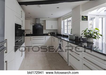 Stock Image - Counters and drawers in modern kitchen. Fotosearch