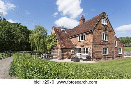 Stock Image - Country house and backyard. Fotosearch