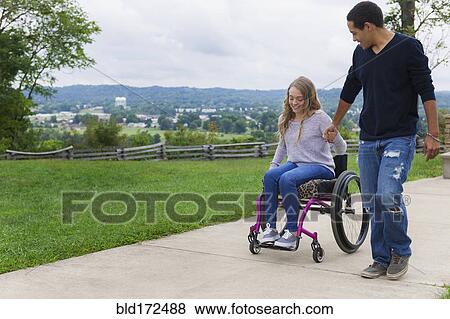 Stock Photo - Couple holding hands in park. Fotosearch
