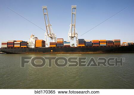 Cranes and shipping containers on barge View Large Photo Image Stock Photography - Cranes and shipping containers on barge. Fotosearch