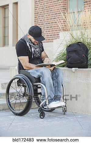 Disabled student in wheelchair reading book View Large Photo Image Stock Image - Disabled student in wheelchair reading book. Fotosearch