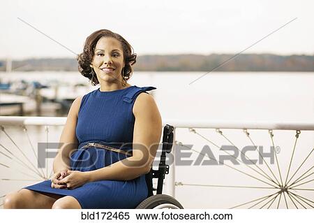 Disabled woman smiling in wheelchair View Large Photo Image Stock Photography - Disabled woman smiling in wheelchair. Fotosearch
