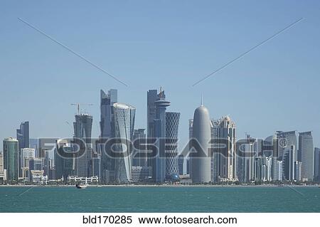Stock Photography - Doha city skyline on waterfront, Doha, Qatar. Fotosearch