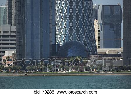 Stock Photograph - Doha highrise buildings over waterfront, Doha, Qatar. Fotosearch