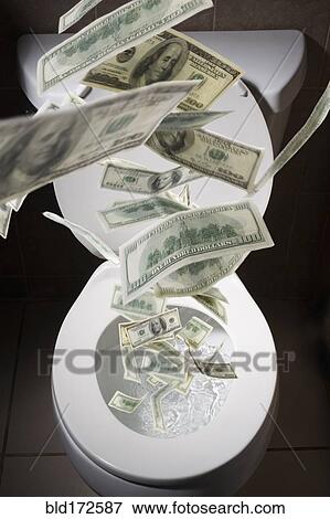 Dollar bills falling into toilet View Large Photo Image Stock Photo - Dollar bills falling into toilet. Fotosearch