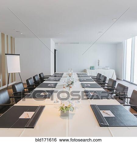 Empty meeting table in conference room View Large Photo Image Stock Photograph - Empty meeting table in conference room. Fotosearch